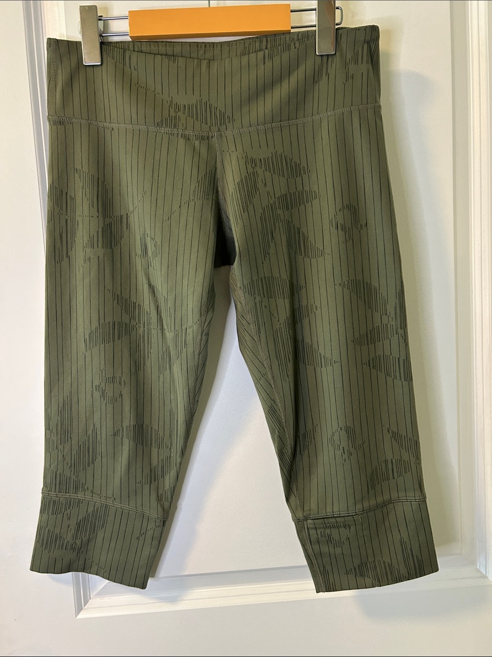 111. Lululemon athletica Olive Green Capri Leggings with Subtle Tonal Pattern